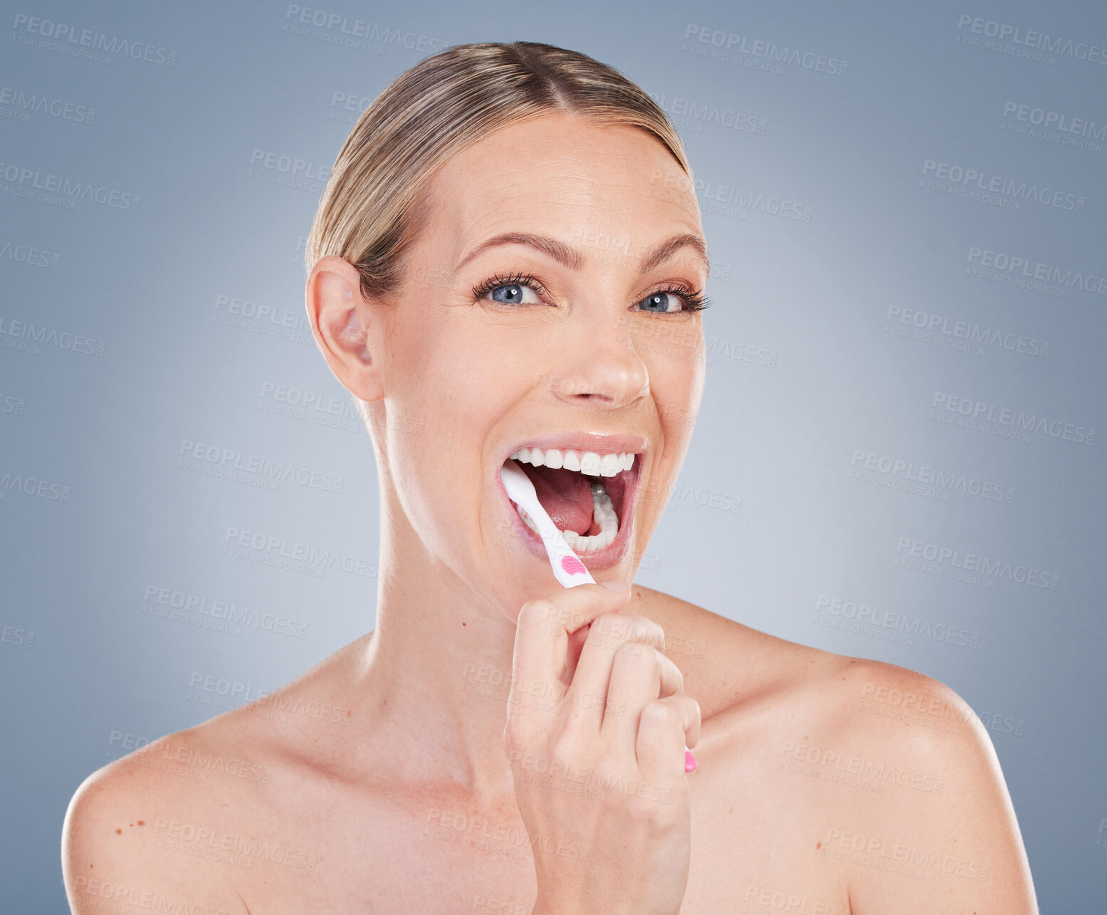 Buy stock photo Woman, portrait and brushing teeth in studio with toothbrush, happy and oral hygiene for self care. Mouth, health and cleaning plaque for dental wellness, dentist approved product and fresh breath