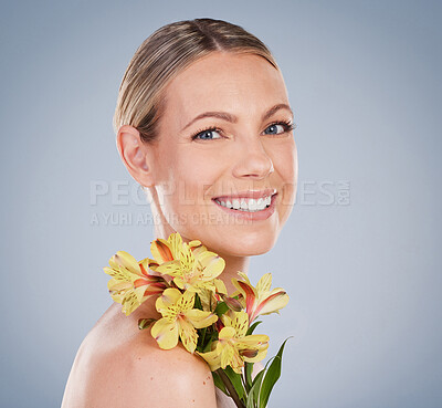 Buy stock photo Flowers, skincare and portrait of woman with bouquet or natural beauty on studio background. Floral, fragrance and model with clean dermatology cosmetics, perfume scent and makeup for spring