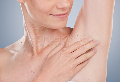 Buy stock photo Person, smile and touching armpit for hygiene with studio background for fresh smell, wellness and wellbeing. Woman, arm up and happy with shaving hair for deodorant and satisfied for results