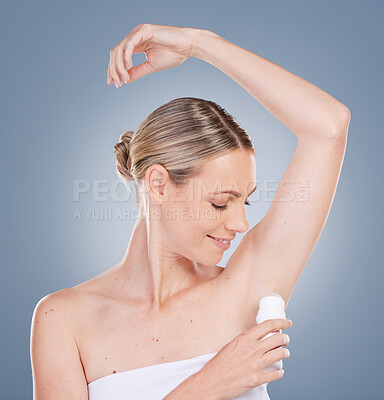 Buy stock photo Woman, armpit and smile with deodorant in studio on grey background for fresh smell, wellness and wellbeing. Female person, hygiene and happy or satisfied with product, body and self care or odor