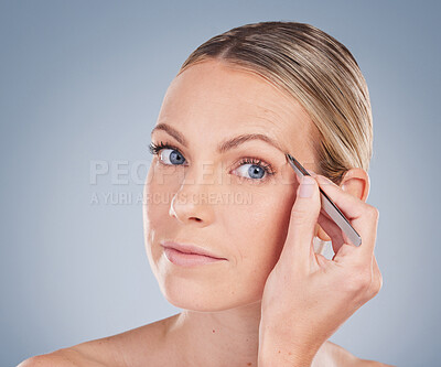 Buy stock photo Studio, face and woman with tweezers for eyebrow, hair removal and shape technique for maintenance. Female model, equipment or cosmetic tool for beauty, grooming and self care by gray background