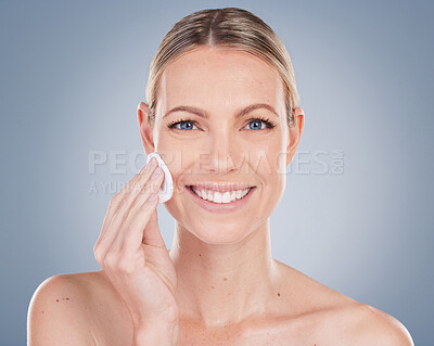 Buy stock photo Woman, portrait and smile with cotton pad for skincare in studio on grey background with routine and exfoliate. Girl, natural and confidence with facial treatment, skin product and makeup remover