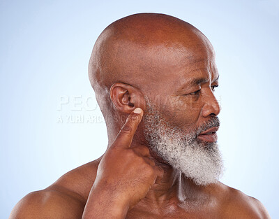 Buy stock photo Mature, black man and ear with hearing loss from age isolated on blue background or itchy with wax. Finger, point and communication with sign language for interaction with auditory issues in studio.