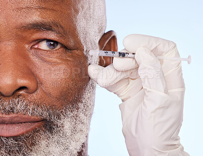 Buy stock photo Injection, skincare and black man in studio with cosmetic, medical and facial procedure with syringe. Hand, needle and mature African male person with face anti aging filler shot by white background.