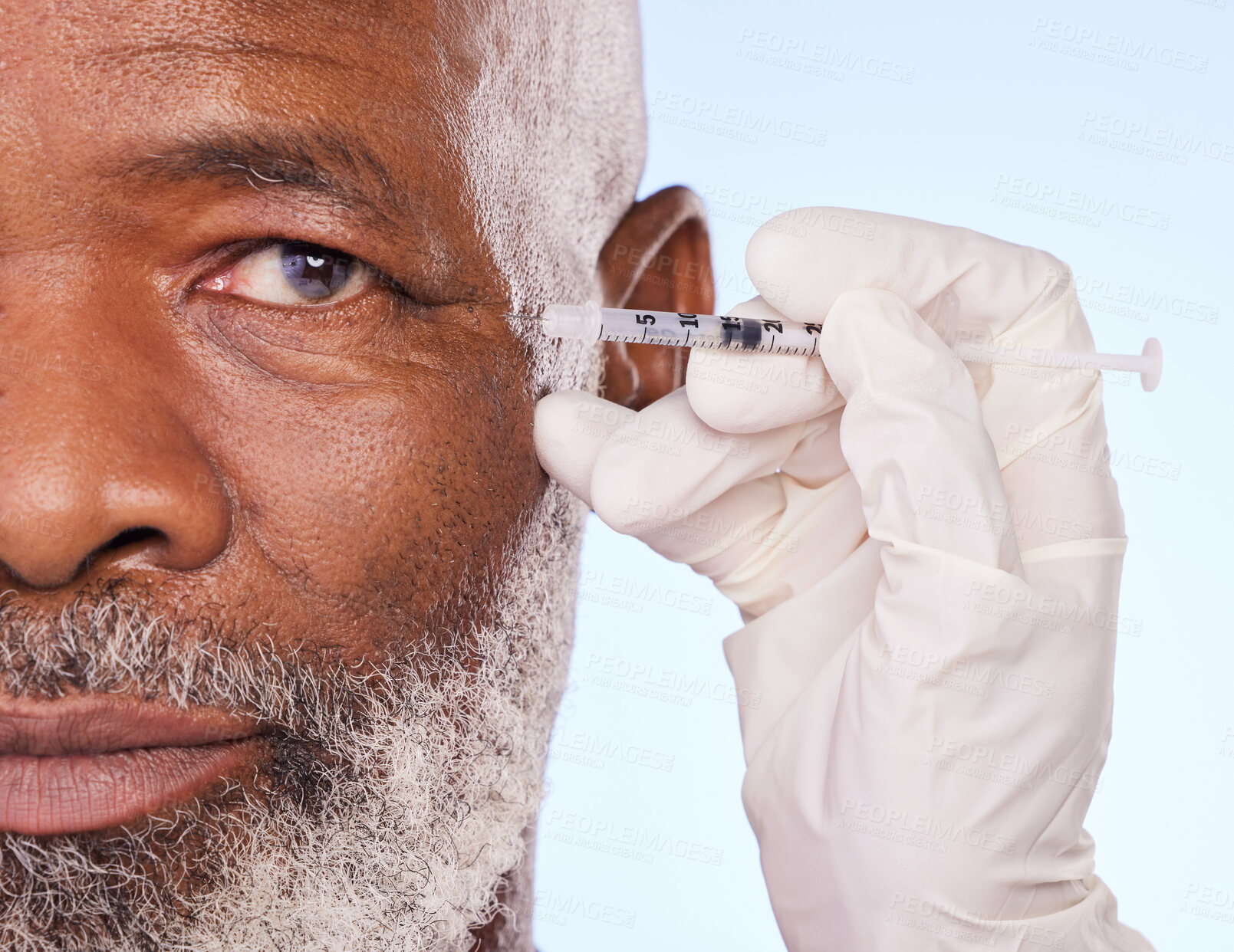 Buy stock photo Injection, skincare and black man in studio with cosmetic, medical and facial procedure with syringe. Hand, needle and mature African male person with face anti aging filler shot by white background.