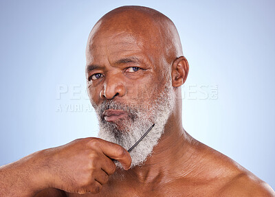 Buy stock photo Senior black man, portrait and beard with comb isolated on blue background for grooming. Style, beauty and hygiene with treatment or brush cosmetics in studio with gray hair, clear skin and wellness.