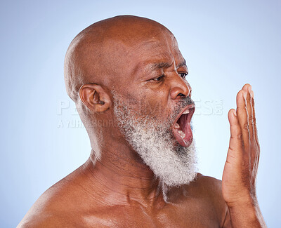 Buy stock photo Breathing, African man and bad breath with hand to mouth for smell, gingivitis and dental issue. Mature person, check and poor oral hygiene in studio for gum disease, halitosis and bacteria on tongue