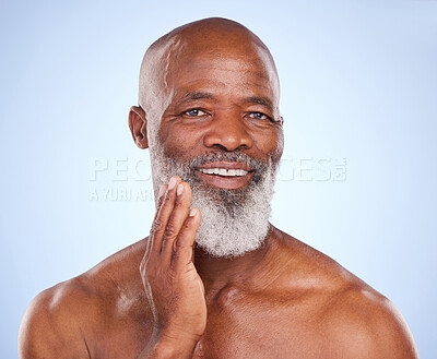 Buy stock photo Man, studio and beard with care in portrait for beauty, oil or cosmetics for soft hair with shine. Male person, blue background and smile for wellness with aesthetics, shirtless with self care