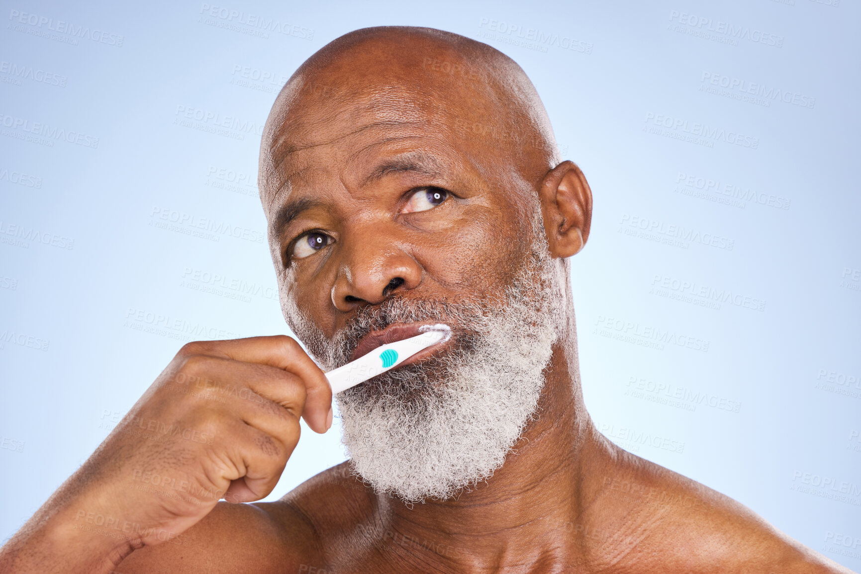 Buy stock photo Toothbrush, face and black man for dental healthcare, studio or oral hygiene on blue background. Selfcare, thinking and toothpaste for male person, beauty or cosmetic for cleaning or fresh breath