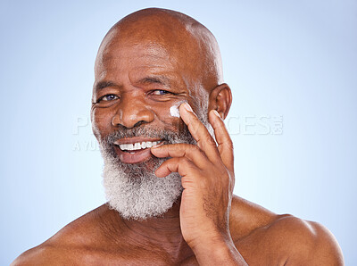 Buy stock photo Skincare, beauty and portrait of black man and cream in studio for sunscreen, anti aging or spa. Cosmetics, mockup or self care with lotion on face of model on blue background for facial and product