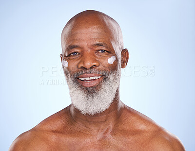 Buy stock photo Skincare, cream and smile with portrait of black man in studio for sunscreen, anti aging or beauty. Cosmetics, mockup or self care with face lotion model on blue background for facial and spa product