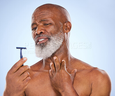 Buy stock photo Accident, shaving and man with beard in studio for grooming, hair removal or self care treatment. Injury, clean and mature male person with shaver for facial epilation routine by white background.