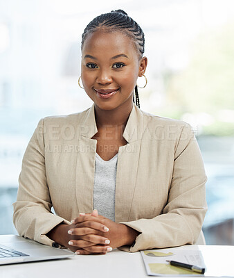 Buy stock photo Shot of a young businesswoman working in an office