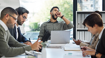 Buy stock photo Shot of a young businessman yawning in a meeting at work
