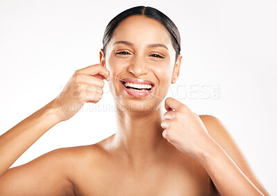 Buy stock photo Happy woman, portrait and dental floss for teeth, hygiene or cleaning against a white studio background. Face of female person or model flossing tooth with smile for clean oral, mouth or gum care