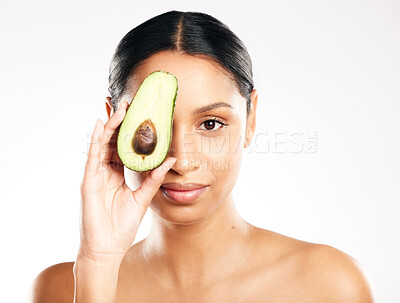 Buy stock photo Woman, portrait and avocado on face in skincare, natural beauty or nutrition against a white studio background. Female person or model with organic fruit or vegetable for healthy skin, diet or facial