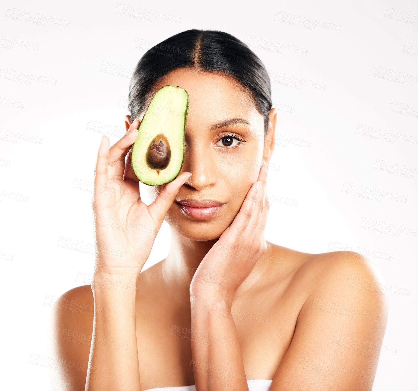 Buy stock photo Woman, portrait and avocado in natural skincare, beauty or nutrition against a white studio background. Face of female person or model with organic fruit or vegetable for healthy skin, diet or facial