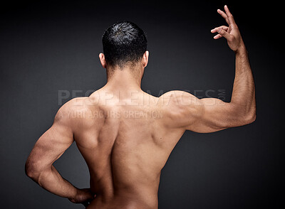 Buy stock photo Muscular man, back and fitness with muscle for strength, workout or exercise in studio on a black background. Rear view of male person, bodybuilder or strong model with bicep, shoulder or deltoid