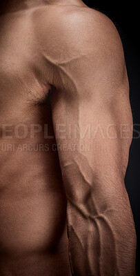 Buy stock photo Body, arm and person in studio with veins for strong muscle, bodybuilder or fitness on dark background. Closeup, power and male athlete with forearm for strength training, flexing or workout goal 