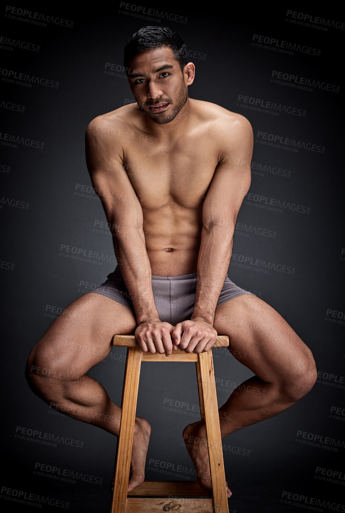 Buy stock photo Confident, portrait and man body in studio fitness, wellness and muscular care for inspiration on chair. Person, aesthetic and exercise with strength workout for health on stool by black background