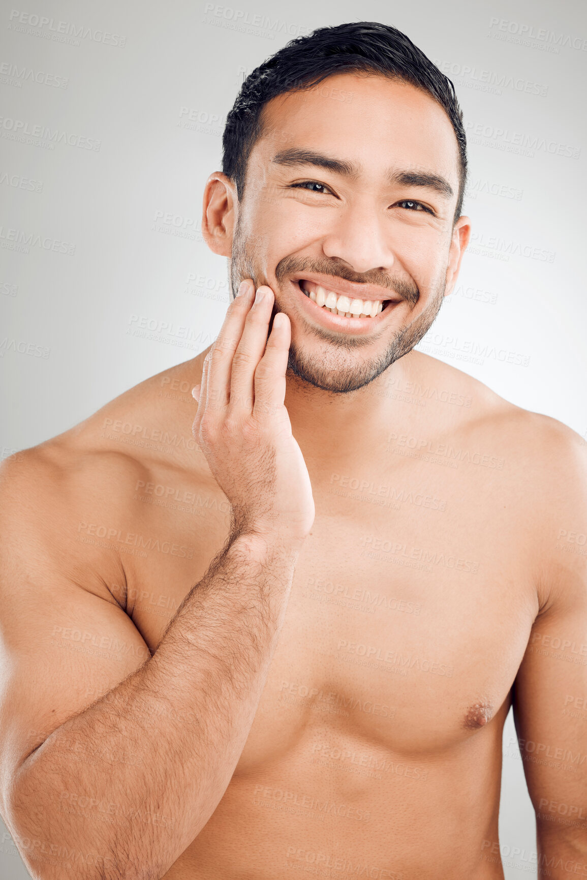 Buy stock photo Portrait, hand and grooming of man in studio with morning routine for hygiene, wellness or natural treatment on white background. Skincare, body and asian model for confidence, facial or satisfaction