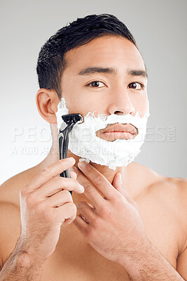 Buy stock photo Grooming, man and shaving cream in portrait, routine or wellness with facial foam for hygiene on studio background. Male person, razor and smooth face with cosmetics, skincare and hair removal