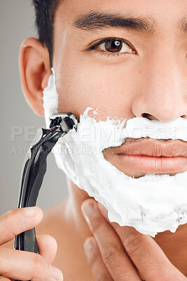 Buy stock photo Grooming, man and shaving foam in portrait, routine or wellness in facial care, hygiene on studio background. Male person, razor and smooth skin with cosmetics for care, hair removal or fresh face
