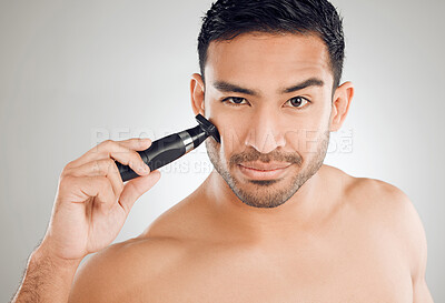 Buy stock photo Electric razor, shaving and studio portrait of man for cleaning, routine and confidence. Hair removal, male model and epilation for wellness, hygiene and skincare or dermatology by white background