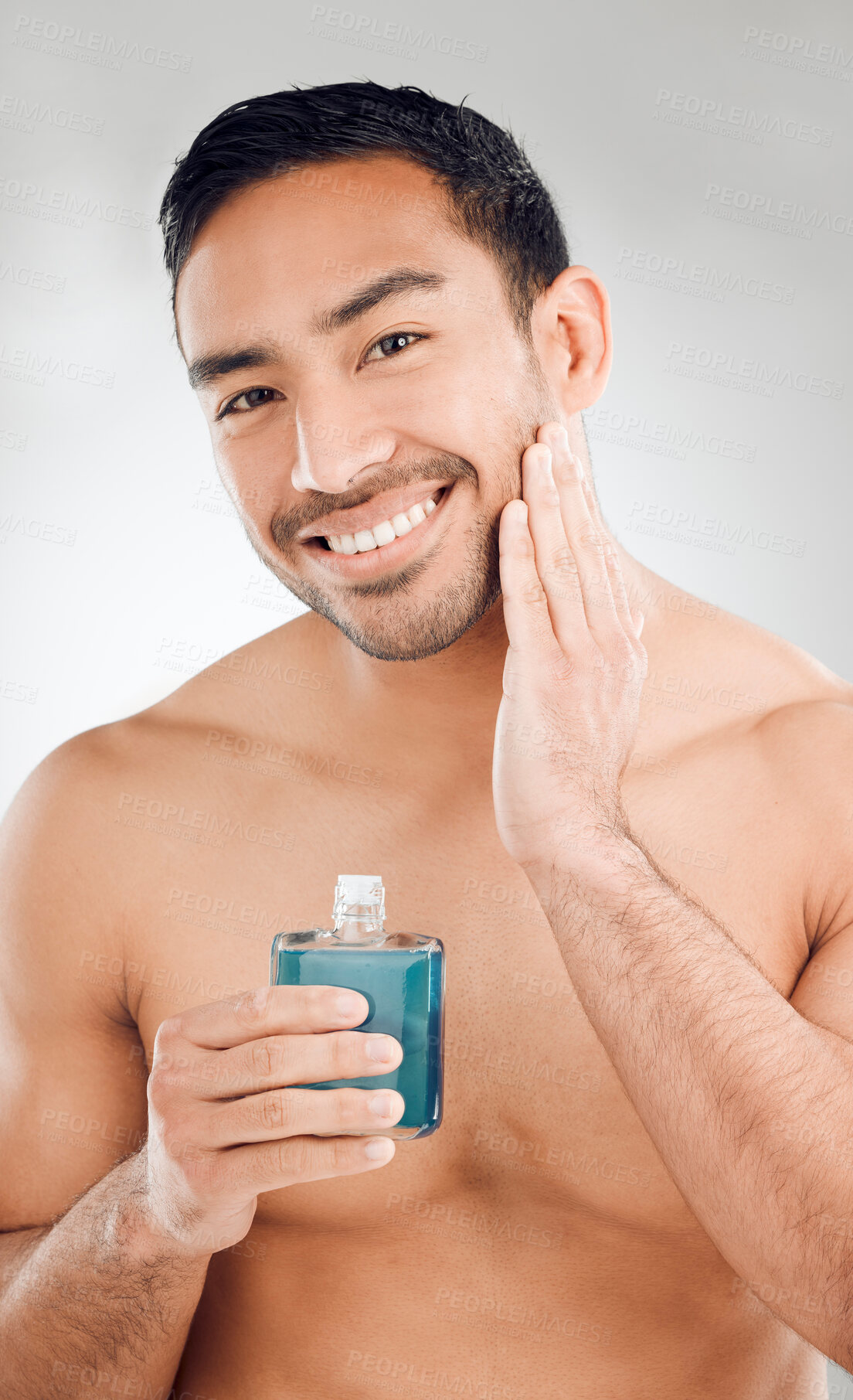 Buy stock photo Cologne, portrait and Asian man in studio for cosmetics, routine and confidence for perfume. Hygiene, male model and product for glow, shine and wellness or pride for dermatology by white background