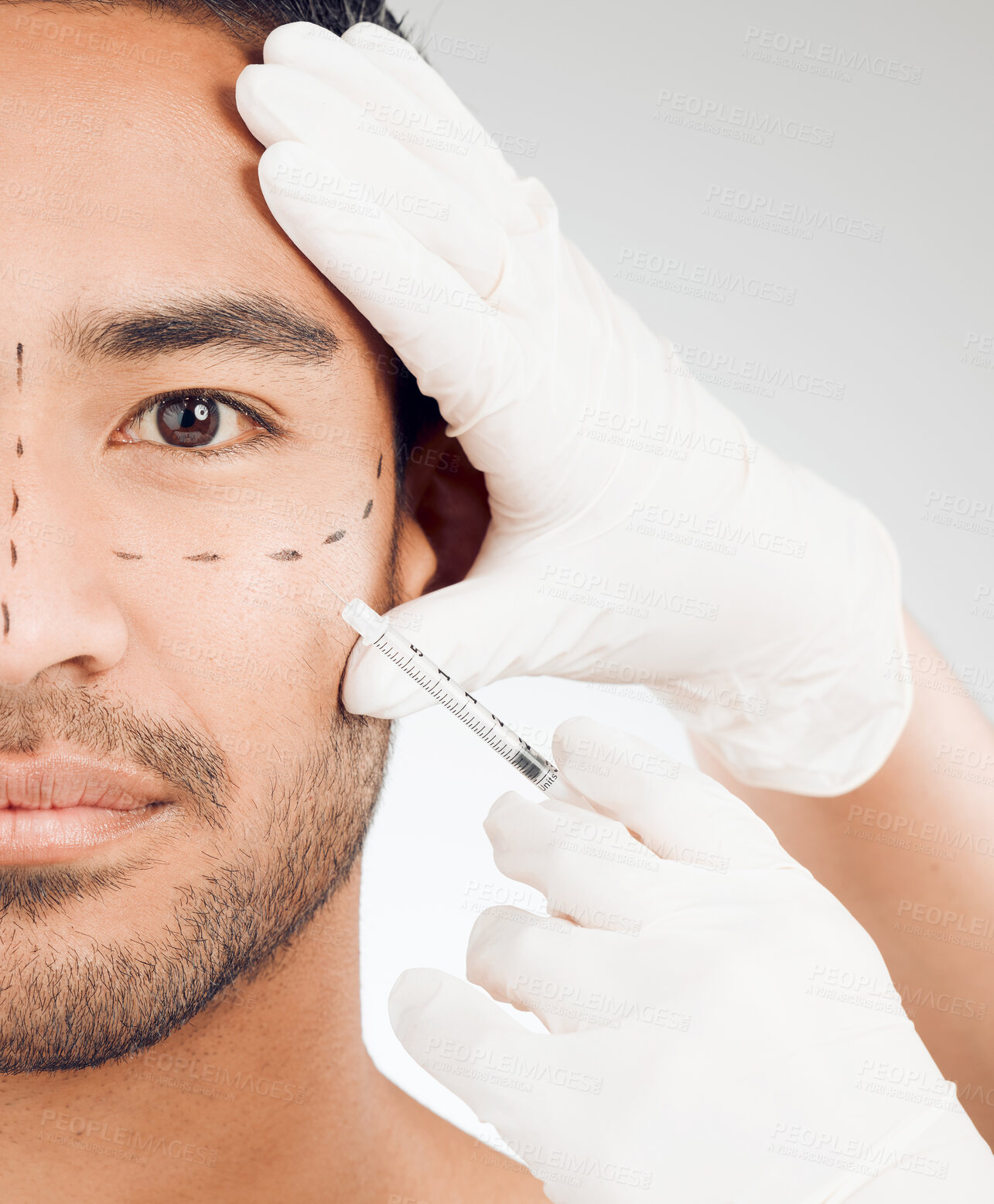 Buy stock photo Man, hands and drawing marks on face for plastic surgery, rhinoplasty and cosmetic procedure in studio. Male person, surgeon and needle or syringe placement for facelift, nose job and blepharoplasty