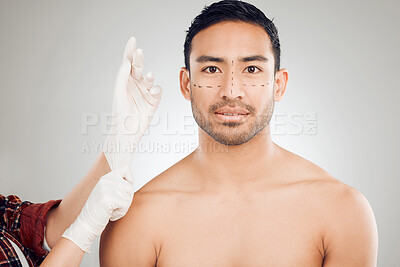 Buy stock photo Plastic surgery, hands and drawing marks on face for man, rhinoplasty and cosmetic procedure in studio. Male person, surgeon and needle or syringe placement for facelift, nose job and blepharoplasty