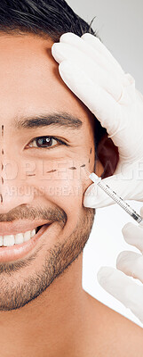 Buy stock photo Man, hand and drawing marks on facial for plastic surgery, rhinoplasty and cosmetic procedure in studio. Male person, surgeon and needle or syringe placement for facelift, nose job and blepharoplasty