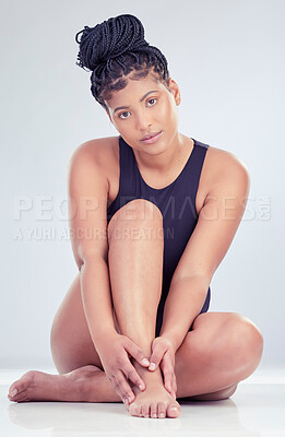 Buy stock photo Skincare portrait, underwear and woman on studio floor for waxing or epilation and beauty glow with smooth or soft skin. Swimsuit, African girl and legs for hair removal cosmetics by white background