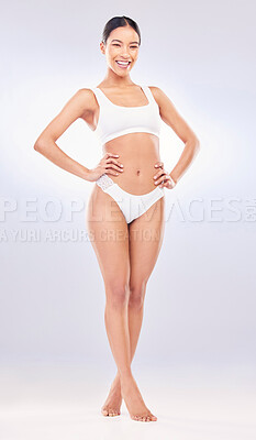 Buy stock photo Full length shot of an attractive young woman standing alone in the studio and posing in her underwear