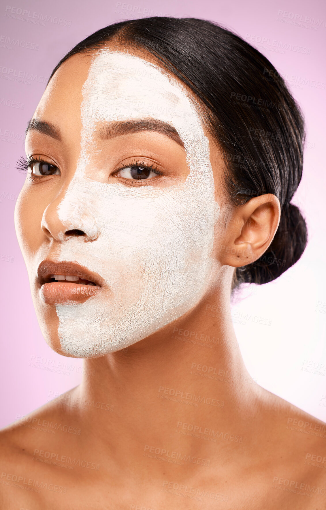 Buy stock photo Woman, facial and studio for clay mask or cleaning pores, detox and skincare on pink background. Female person, beauty and half for comparison results, acne cosmetics and exfoliate or dermatology