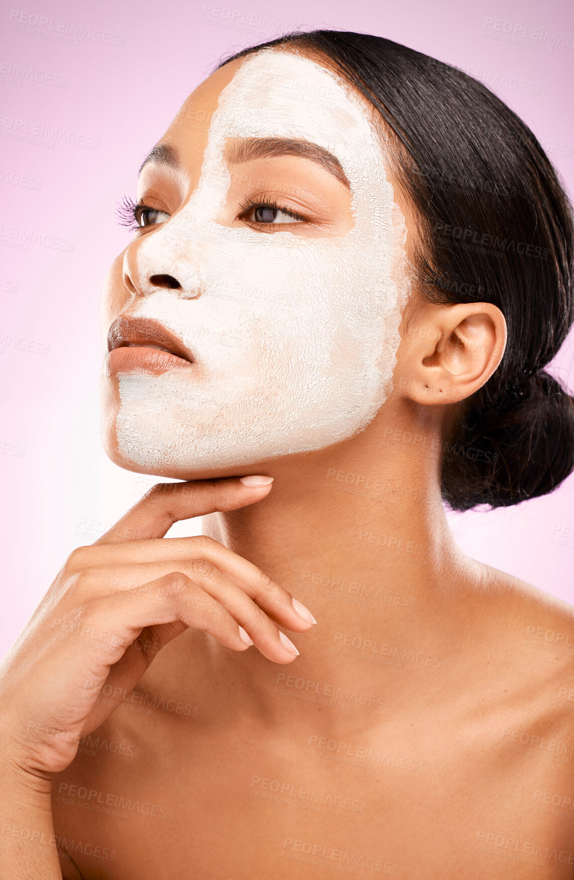 Buy stock photo Woman, facial mask and skincare in studio for treatment, detox and cleaning on pink background. Female person, beauty and half for comparison results, acne cosmetics and exfoliate or dermatology