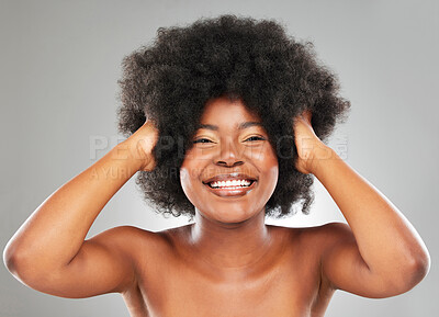 Buy stock photo Afro, black woman and studio portrait for hair care, texture and glow or shine for transformation. Happy, model girl and beauty, wellness and growth for cosmetics and results by grey background