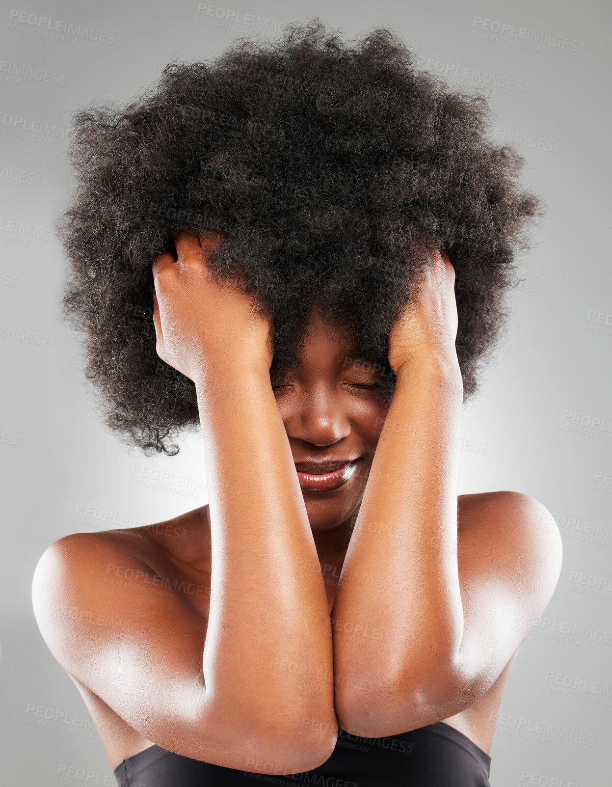 Buy stock photo Happy, afro and black woman with eyes closed, hair care and healthy growth for treatment or style. Female person, wellness and volume for texture, cosmetics and natural aesthetic on gray background