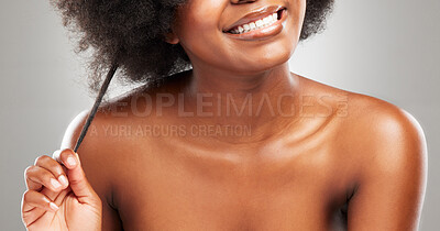 Buy stock photo Smile, black woman and hand for hair care in studio for afro and texture with glow from transformation. Happy, model girl and beauty, wellness and growth for cosmetics and results by grey background