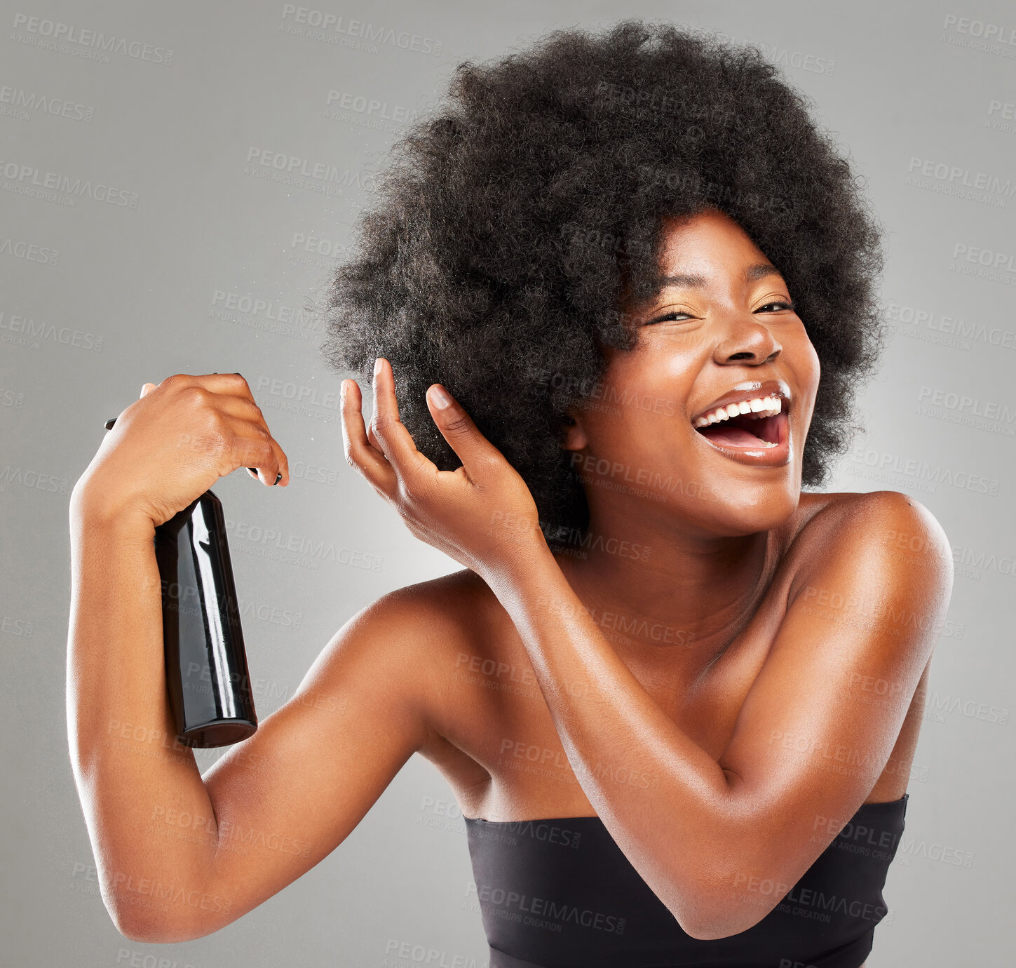 Buy stock photo Hair care, portrait and black woman with spray in studio for cosmetics, growth treatment or grooming on gray background. Afro, natural and model with spa product for glow, shine or beauty moisturizer