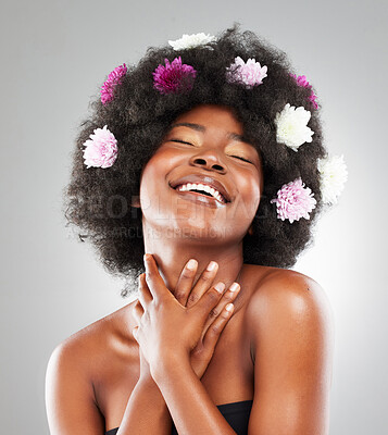 Buy stock photo Black woman, studio or flowers for natural haircare or skin, beauty transformation for wellness. Female person, floral beauty or cosmetic with white background for salon treatment, aesthetic in Kenya