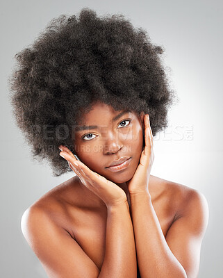 Buy stock photo Portrait, afro and black woman in studio for wellness, dermatology and results for skincare. Hands, model girl and natural hair for beauty, cosmetics and aesthetic or self care by grey background