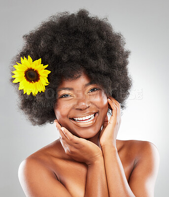 Buy stock photo Black woman, portrait or sunflower for hair care, afro aesthetic or beauty transformation with smile. Happy African person, studio or floral cosmetics on white background for salon treatment or skin