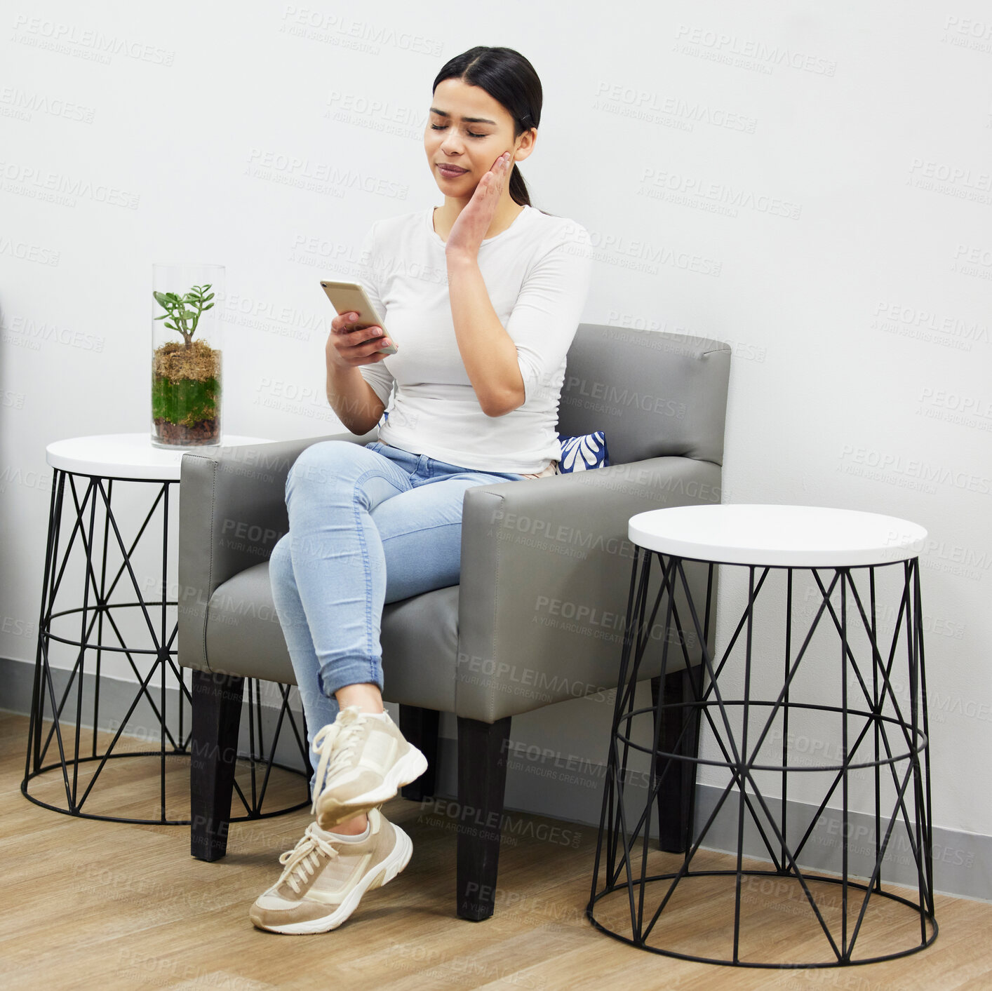 Buy stock photo Girl, online and texting on smartphone with toothache, waiting room and hand on mouth for pain by dentist. Woman, cellphone and internet for social media with discomfort, patient and appointment.