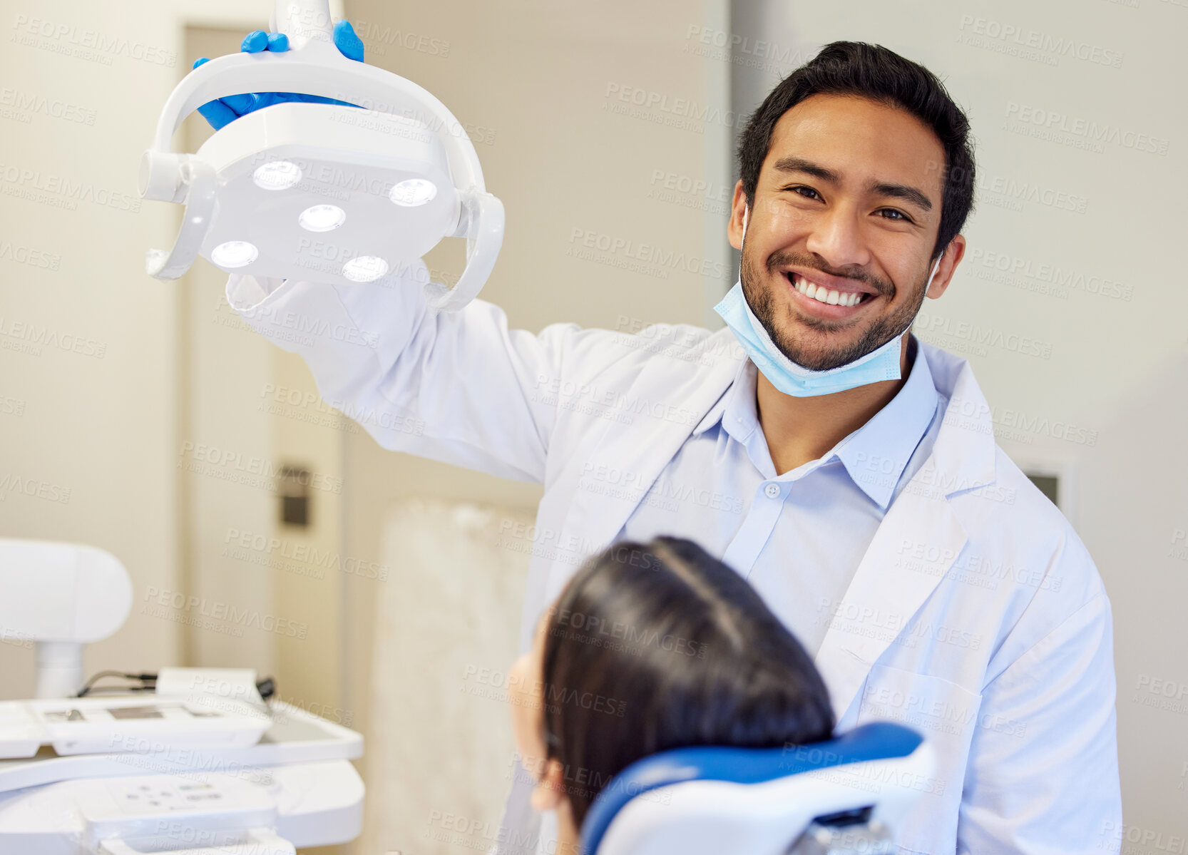 Buy stock photo Dentist, portrait and man in clinic with light for consultation, oral hygiene or medical procedure. Service, equipment and wellness with patient for teeth examination, orthodontics or dental care