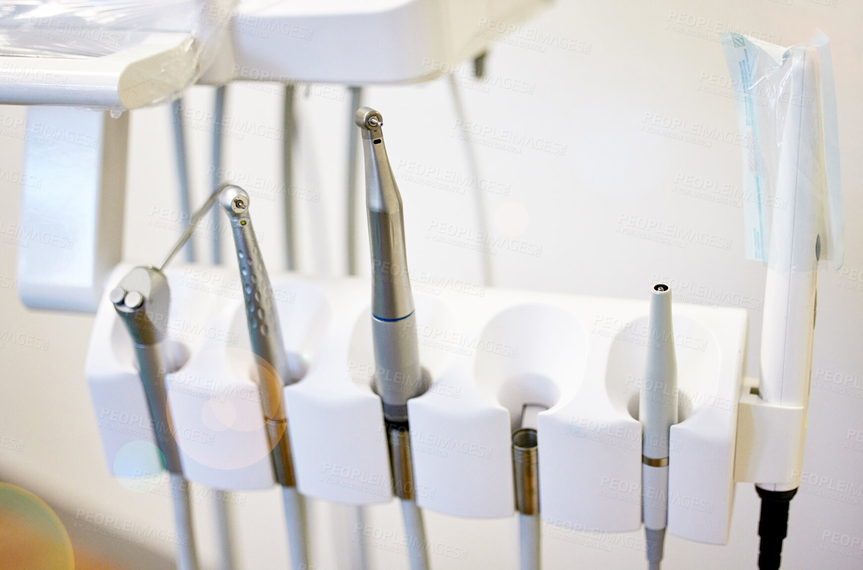 Buy stock photo Closeup, metal and dental tools in machine with instrument layout for teeth cleaning or oral surgery. Healthcare, dentistry equipment or setup for tooth wellness, mouth procedure or medical treatment