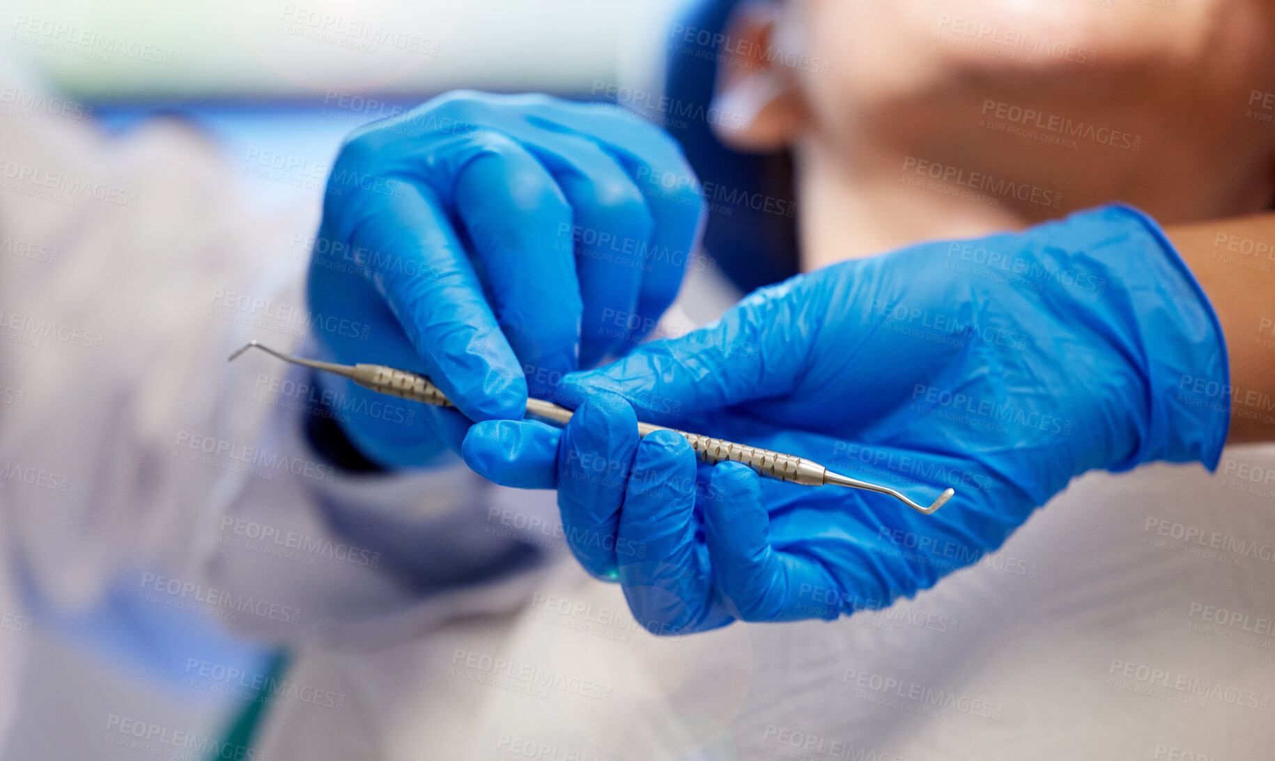 Buy stock photo Shot of a young woman having a dental procedure performed on her