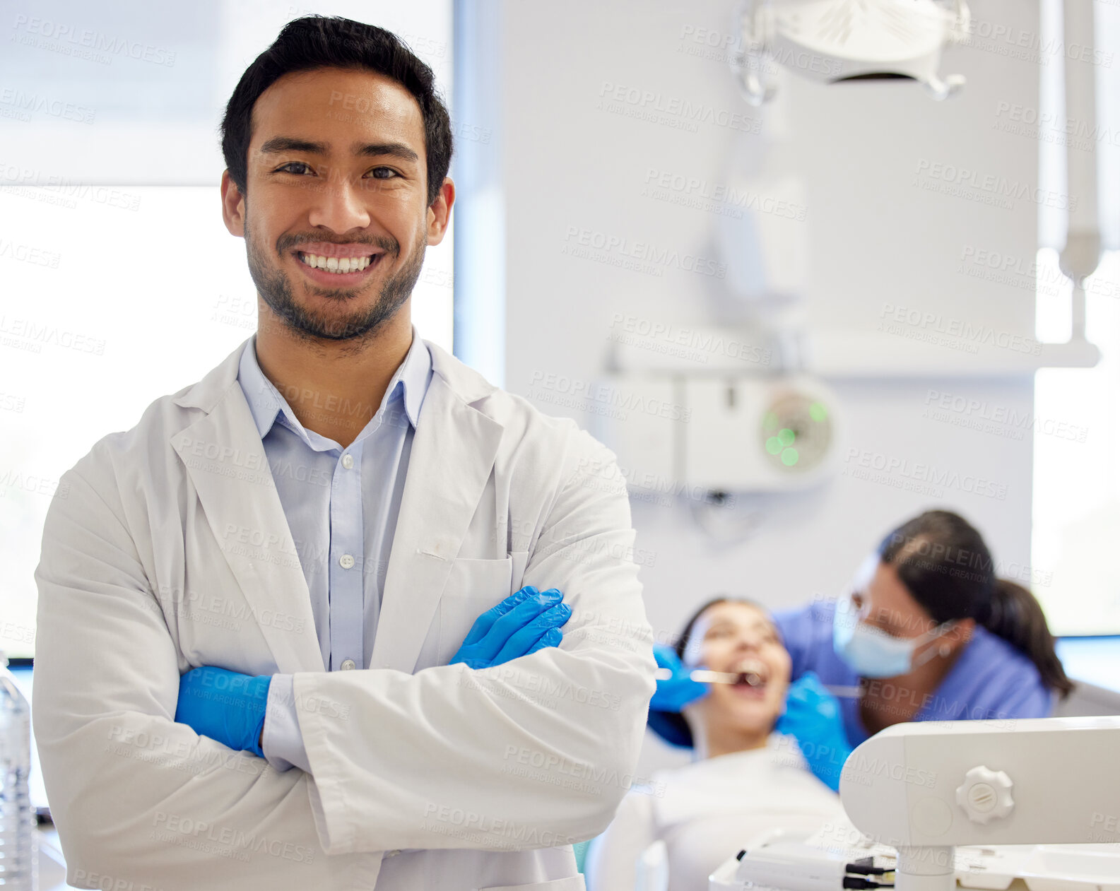 Buy stock photo Portrait of confident a young dentist working in his consulting room