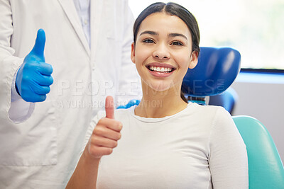 Buy stock photo Portrait of a young woman showing thumbs up while visiting the dentist