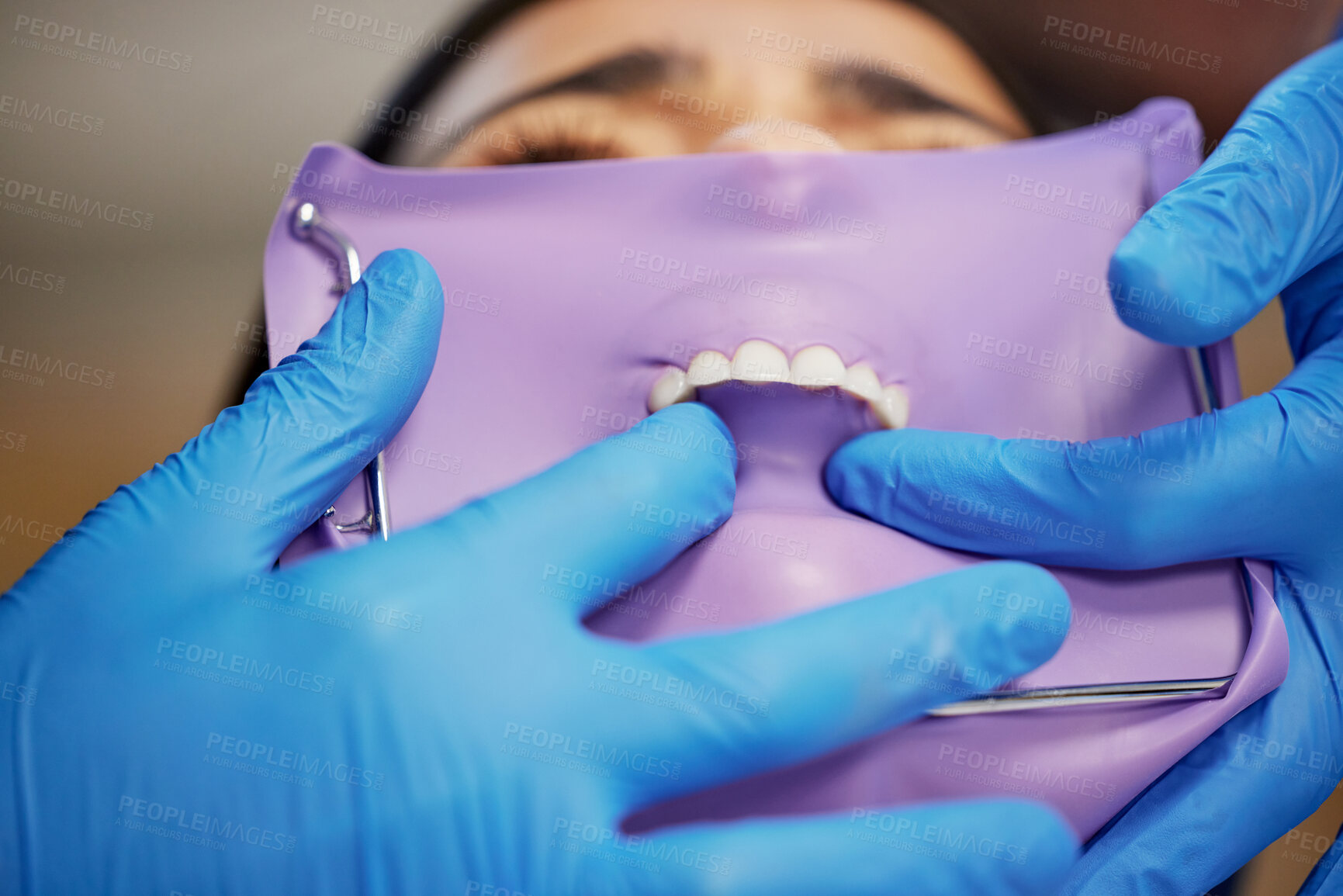 Buy stock photo Shot of a young woman having dental work done on her teeth